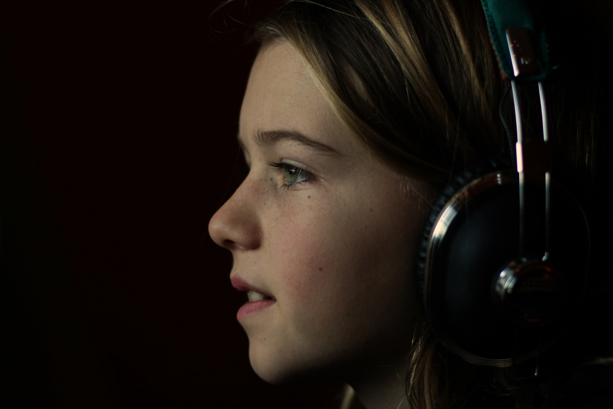 profile of girl listening to headphones