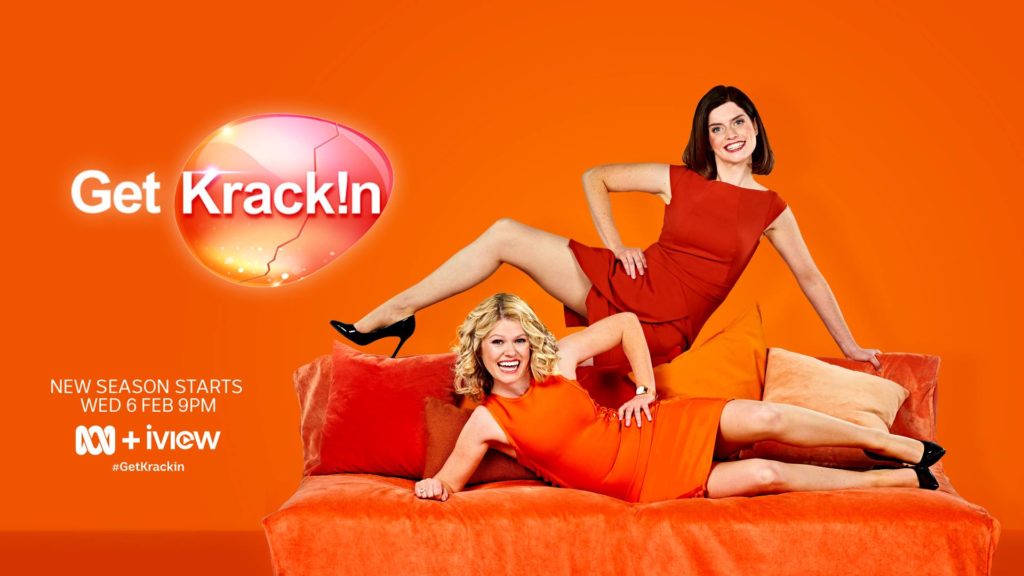 Promotional image showing Get Krack!n hosts Kate McLennan and Kate McCartney posing cheerfully on a couch. Text states "New season starts Wed 6th Feb 9pm on ABC iview #getkrackin"